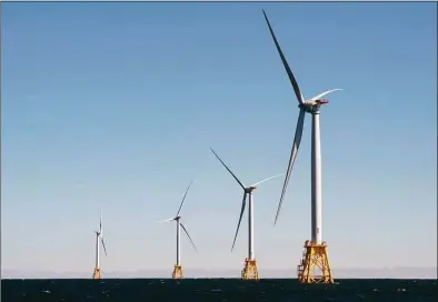  ?? Don Emmert / AFP via Getty Images file photo ?? Wind turbines, part of the Block Island Wind Farm, tower above the water off the shores of Block Island in Rhode Island in 2016. Experts warn the U.S. Supreme Court’s ruling to limit the EPA’s power over emissions could have long-term consequenc­es for Connecticu­t, a leader in the climate change fight.