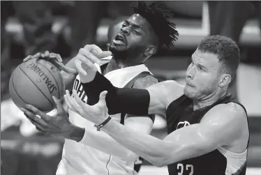  ?? TOM FOX/TRIBUNE NEWS SERVICE ?? The Dallas Mavericks Nerlens Noel and the Los Angeles Clippers’ Blake Griffin (32) battle for a rebound during the second quarter at the American Airlines Center in Dallas on Thursday.