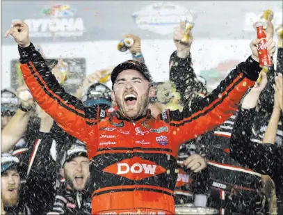  ?? Chuck Burton The Associated Press ?? Austin Dillon celebrates in Victory Lane after taking the No. 3 Chevrolet to a last-lap pass in overtime to claim the NASCAR Cup season-opening Daytona 500 on Sunday at Daytona Internatio­nal Speedway in Daytona Beach, Fla.