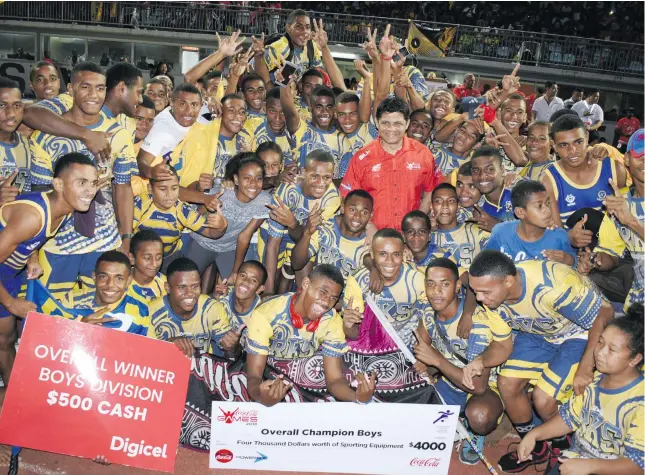  ?? Photo: Ronald Kumar ?? 2018 Coca-Cola Games boys division winner, Ratu Kadavulevu School, with Acting Prime Minister and Attorney-General Aiyaz Sayed-Khaiyum at the ANZ Stadium in Suva on April 21, 2018.