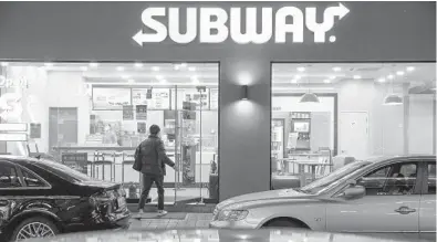  ?? JEAN CHUNG/THE NEW YORK TIMES ?? Subway shops pop with bright colors and serve as the setting for business meetings, social gossip and dates for couples on television shows in South Korea. Above, a Subway restaurant Feb. 11 in Gyoenggido, South Korea.