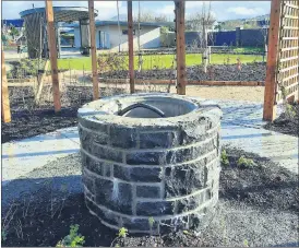  ?? ?? A focal point at the Ballylande­rs Sensory Garden is the attractive well, pictured nearing completion.