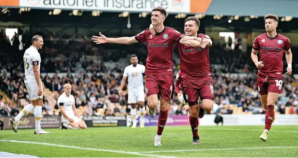  ?? Nathan Stirk ?? ● Jake Beesley celebrates after heading home Dale’s second goal in the 3-2 win against Port Vale at Vale Park on Saturday