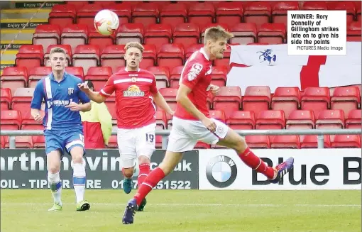  ?? PICTURES:Media Image ?? WINNER: Rory Donnelly of Gillingham strikes late on to give his side the points