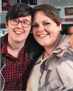  ??  ?? So happy: Lyra McKee (above, left) planned to propose to Sara Canning. Left: A message of support in Londonderr­y