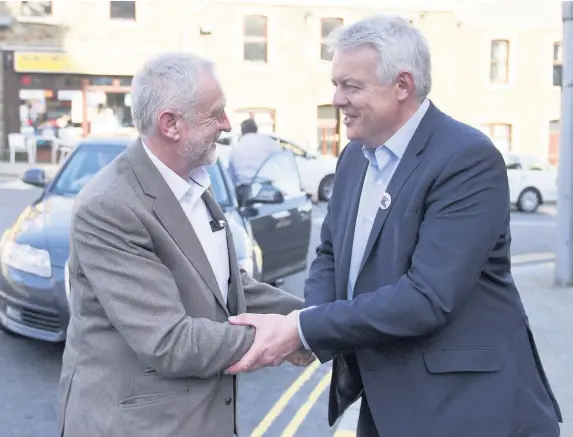  ?? Matthew Horwood ?? > Labour Party leader Jeremy Corbyn greets First Minister Carwyn Jones during a visit to Maesteg ahead of the 2016