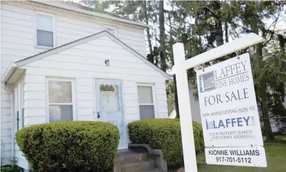  ?? — Reuters ?? A ‘for sale’ is seen outside a single family house in Garden City, New York.