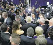  ?? JOHN LOCHER/ASSOCIATED PRESS ?? Donald Trump is surrounded by the media after the opening presidenti­al debate on Monday night.