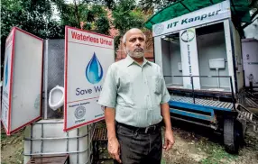  ??  ?? WATERLESS WONDER Dr Vinod Tare in front of a ZDTS toilet