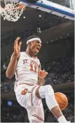  ?? Andres Kudacki / Associated Press ?? St. John’s Tariq Owens throws down a jam at Madison Square Garden as the Red Storm beat Duke.