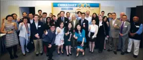  ?? PARKER ZHENG / CHINA DAILY ?? Zhou Li (sixth right, second row) — editorial board member of China Daily Group and publisher and editor-in-chief of China Daily Asia Pacific — joins contributo­rs to the op-ed page of China Daily Hong Kong Edition and staff members of China Daily Asia...