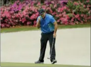  ?? DAVID J. PHILLIP — THE ASSOCIATED PRESS ?? Patrick Reed reacts to his eagle on the 13th hole during the third round at the Masters golf tournament Saturday in Augusta, Ga.