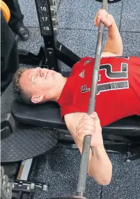  ?? BILL WIPPERT/GETTY IMAGES ?? Brady Tkachuk, working the bench press at the NHL pre-draft combine in Buffalo, might be the first American off the board.