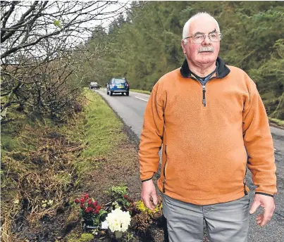  ?? Photograph by Sandy McCook ?? ANGER: Roderick Maciver at the vandalised roadside memorial yesterday.