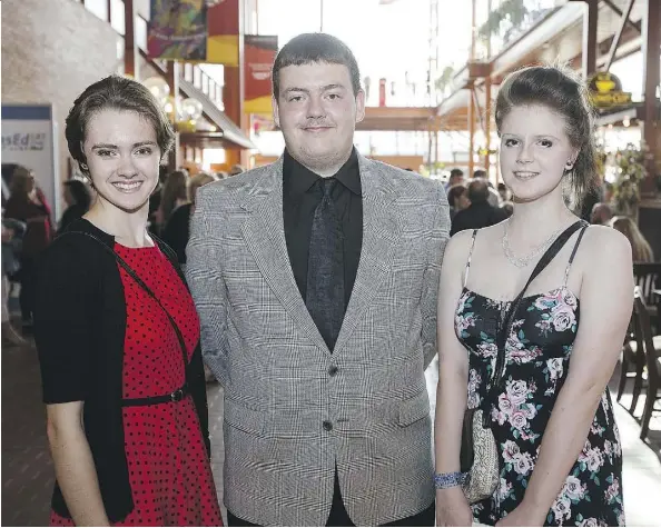  ?? PHOTOS: CODIE MCLACHLAN ?? From left, Katie Parent, Machael Marciano and Courtney Fauht of Austin O’Brien Catholic High School attend the Cappies Gala at the Citadel Theatre last Sunday, where excellence in Edmonton-area high school theatre was celebrated.