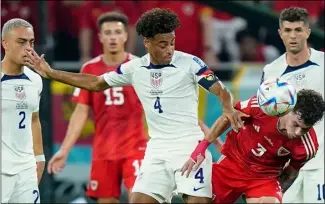  ?? Photo by Jabin Botsford / The Washington Post ?? Tyler Adams (4) and the United States men’s national team earned a tie against Wales Monday, but ties aren’t going to be good enough to advance in the World Cup.