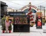  ?? ALYSSA POINTER / ALYSSA.POINTER@AJC.COM ?? A decorated Christmas tree awaits holiday shoppers Monday at Atlantic Station, where a massive brawl involving more than 300 teenagers broke out Saturday evening. One boy needed medical attention, though he was expected to be OK.