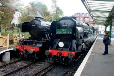  ?? ANDREW PM WRIGHT ?? A Gresley Pacific rubs shoulders with a Bulleid counterpar­t: No. 60103 Flying Scotsman alongside West Country No. 34028 Eddystone at Swanage station on October 20.