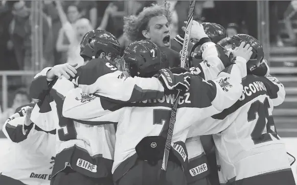  ??  ?? Great Britain players celebrate after defeating Hungary 3-2 during the IIHF World Championsh­ip Division I Group A match in Budapest in April. TAMAS KOVACS/THE ASSOCIATED PRESS