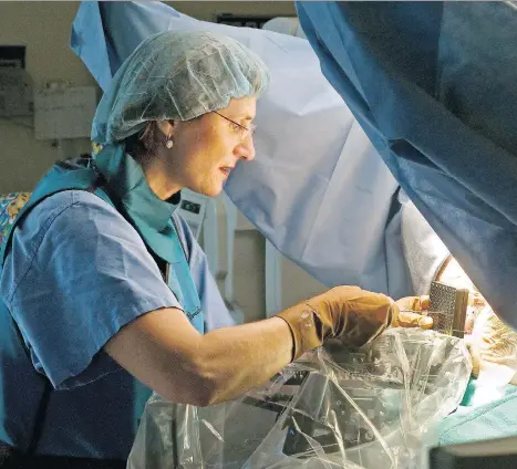  ??  ?? Dr. Mira Keyes, a radiation oncologist with the B.C. Cancer Agency, performs a brachyther­apy procedure involving the placing of radioactiv­e seeds in a man’s prostate. The high-dose-rate brachyther­apy procedure involves temporaril­y placing super-radioactiv­e seeds in the prostate.