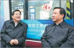  ??  ?? Left: Du Jiahao (left), the Hunan provincial Party chief, talks with Xu Dazhe, governor of Hunan, during their field study trip on a maglev train on Dec 6, 2016. Right: Changsha-Zhuzhou-Xiangtan intercity railway system has become a popular option for...