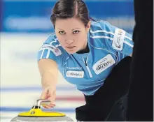  ?? DAVID BEBEE THE RECORD ?? The many closings of curling clubs ‘forces some people out of the sport and forces others to play a little bit less’ says Wilfrid Laurier alum Laura Walker.