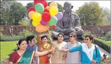  ?? PTI PHOTO ?? Congress MPs release balloons in Parliament on the occasion of Internatio­nal Women's Day in New Delhi on Thursday.