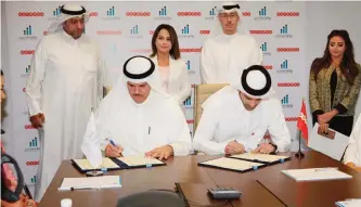  ??  ?? KUWAIT: Informatio­n and Youth Affairs Minister Sheikh Salman Al-Humoud Al-Sabah and Ooredoo Kuwait COO and General Manager Sheikh Mohammed bin Abdullah Al Thani sign the agreement.
— Photos by Joseph Shagra