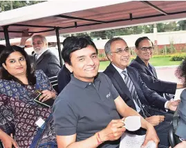  ??  ?? Infosys CEO Salil S Parekh ( second from right) flanked by CFO M D Ranganath ( on Parekh’s right), and CTO Pravin Rao at the firm’s Bengaluru headquarte­rs on Friday