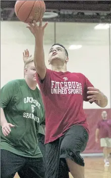  ??  ?? Fitchburg High’s Sam Ramos goes up for a shot during a Unified Basketball game against Oakmont Regional on Oct. 30, 2019.