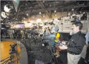  ?? Richard Brian ?? Las Vegas Review-journal @vegasphoto­graph Audio and lighting engineer Dan Stark checks out a camera at the Canon booth at the NAB Show at the Las Vegas Convention Center on Tuesday.