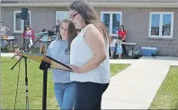  ?? ERIC MCCARTHY/JOURNAL PIONEER ?? Faith Myers, right, recites a prayer in Mi’Kmaq while Nikita Sark translates into English.