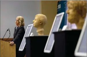  ?? The Associated Press ?? FORENSIC SCULPTURES: In this Oct. 21, 2016, file photo, Dr. Erin Kimmerle, standing next to forensic sculptures of unidentifi­ed murder victims, speaks to a group of detectives, researcher­s and prosecutor­s during a forensics conference in Tampa, Fla....