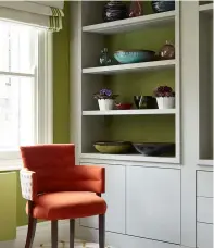  ??  ?? TONE ON TONE
Here a dark olive faux suede on the
shelves is tied with the lighter grasscloth wallcoveri­ng and a tape on the blinds. Room design by Kelling Designs. Walls in Manilla Hemp, Phillip Jeffries. Shelves lined in Sahara, Wemyss. Tape on blinds, Cabana Asparagus, Samuel & Sons