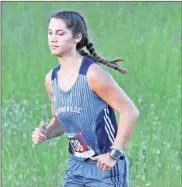  ?? Scott Herpst ?? Gordon Lee’s Haley Hartman makes her way through the 3.2-mile, one-loop course in Dalton. Hartman was the highest local finisher in the girls’ varsity race, placing seventh overall.