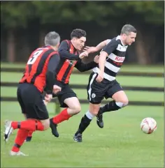  ?? Pictures: Ken Finegan ?? Aaron Comerford of Quay Celtic makes a break past Bellurgan’s Owen Traynor.