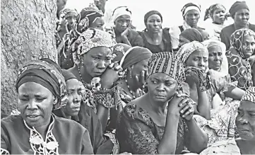  ?? — AFP photo ?? Parents and relatives attend a commemorat­ion five years after their girls were abducted by Boko Haram Jihadists group outside the Chibok Local Government.