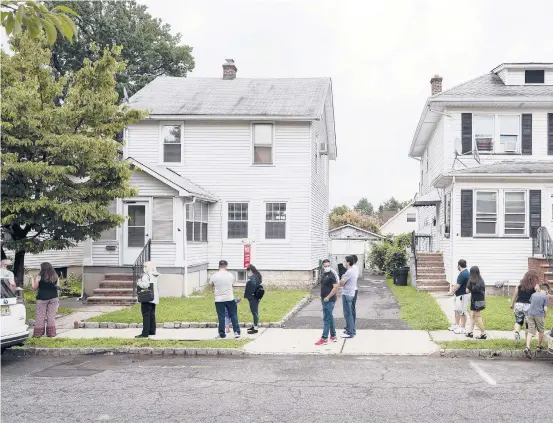  ?? KARSTEN MORAN/THE NEWYORKTIM­ES ?? People line up to tour a house for sale Aug. 16 in Belleville Township, NewJersey. One long-lasting result of the pandemic may be innovation­s that make home buying faster.