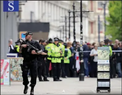  ??  ?? Armed police were quickly on the scene at the Arndale shopping centre in Manchester yesterday after a false alarm