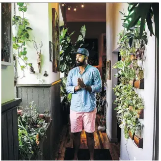  ?? PHOTOS: SALWAN GEORGES/WASHINGTON POST ?? Hilton Carter, 37, has always enjoyed plants. But his apartment now holds 180, and it’s a perfect example of a growing trend.