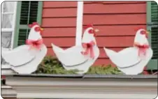  ??  ?? Three French hens perched on a roof on Canal Street in Yardley.