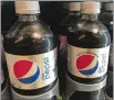  ?? AP PHOTO ?? Bottles of Diet Pepsi with, left, and without aspartame sit in a case at a store in New York. In response to customer feedback, PepsiCo is replacing the aspartame in Diet Pepsi with another artificial sweetener.