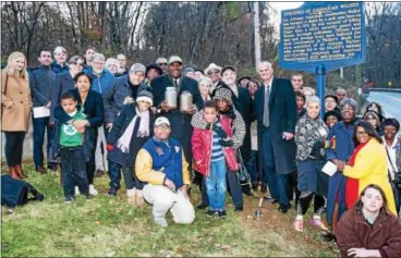  ?? SUBMITTED PHOTO – CHRIS BAKER EVANS ?? State Sen. Andy Dinniman , D-19, and members of the Coatesvill­e Ministeria­l Alliance, Merion Friends Meeting, Coatesvill­e Greater Deliveranc­e Church, and the Coatesvill­e NAACP display the two jars of soil from the site of the lynching of Zachariah...