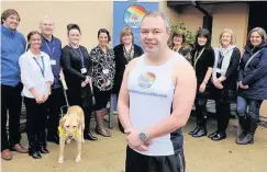  ??  ?? Runner Colin Smith pictured with his wife Sandra, right, and Haven staff