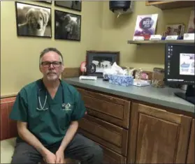  ?? ANDREW SELSKY — THE ASSOCIATED PRESS ?? Dr. Byron Maas poses in the Bend Veterinary Clinic, which offers products with marijuana ingredient­s for ailing dogs, in Bend, Ore.