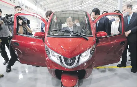  ?? Picture: EPA-EFE ?? South Korean Prime Minister Chung Syekyun in a tricycle electric car, dubbed Echo-ev, during a visit to an e-mobility research center at Daema EV Industrial Complex in Yeonggwang, South Jeolla Province, South Korea, yesterday. The model is for export to the Philippine­s.