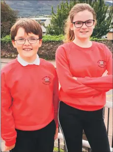  ??  ?? Finlay Wilson, P6, and Gabriella van Poecke, P7, Dalintober’s Rights Respecting Schools Ambassador­s.