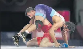  ?? PTI ?? India's Bajrang Punia in action against Haji Aliyev of Azerbaijan in the 65kg semi-finals.
