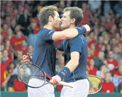 ??  ?? Britain’s Andy Murray, left, and Jamie Murray celebrate winning their doubles match.