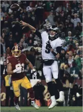  ?? TONI L. SANDYS THE WASHINGTON POST ?? New Orleans Saints Drew Brees and Philadelph­ia Eagles Nick Foles, both Super Bowl MVPs, attended the same Texas high school and will meet in the NFL Divisional Playoffs Sunday.